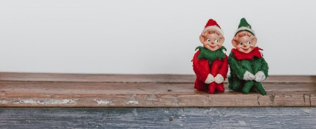 two elf on the shelf figurines