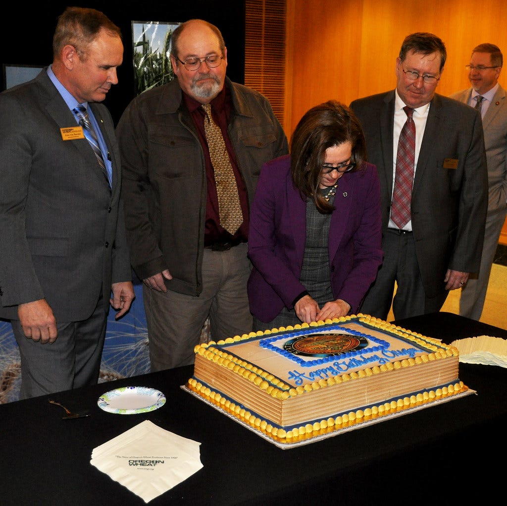 Governor Kate Brown cuts Oregon birthday cake Governor Kate Brown cuts Oregon birthday cake