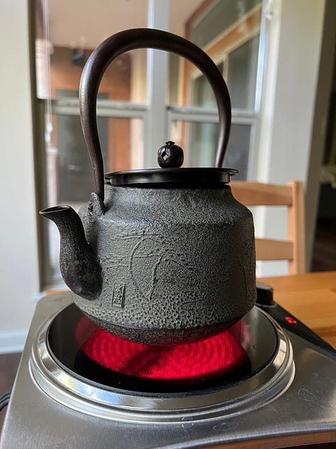 A Japanese tetsubin with packaging and on a hot plate