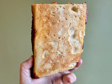 Pictures of pizza slices from Sid's