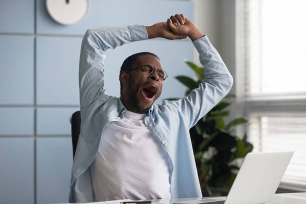 40+ Entrepreneur Yawning While Stretching At Office Desk Stock Photos,  Pictures & Royalty-Free Images - iStock