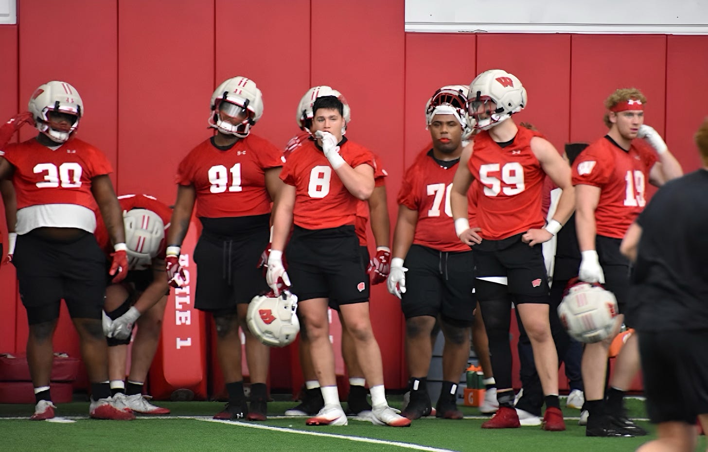 Wisconsin Badgers linebacker Mason Posa stands with the defense on the sideline during spring practice. Wisconsin Badgers linebacker Mason Posa stands with the defense on the sideline during spring practice.