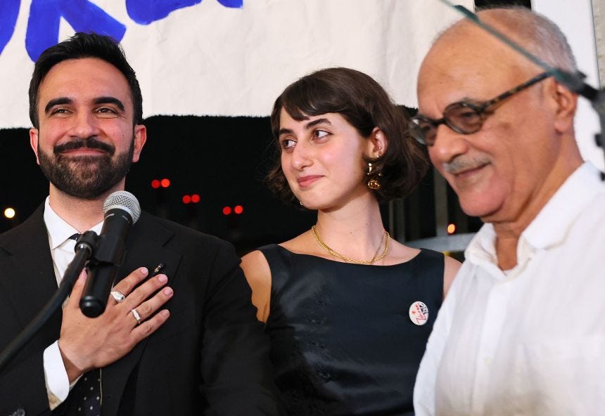 Rama Duwaji, center, looks at her husband, New York City mayoral candidate Zohran Mamdani, during Mamdani's primary night party on June 24, 2025.