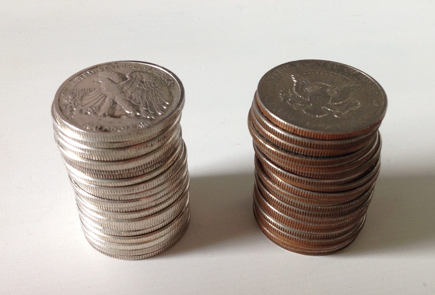 File:Two stacks of half dollars, one silver, one clad - effects of the  Coinage Act 1965.jpg - Wikimedia Commons