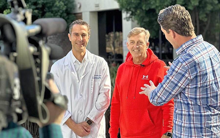 Scripps Clinic cardiologist Christopher Suhar, MD, (left) and patient Mark Whitney (center) being interviewed by CBS 8 reporter Jeff Zevely. Scripps Clinic cardiologist Christopher Suhar, MD, (left) and patient Mark Whitney (center) being interviewed by CBS 8 reporter Jeff Zevely.