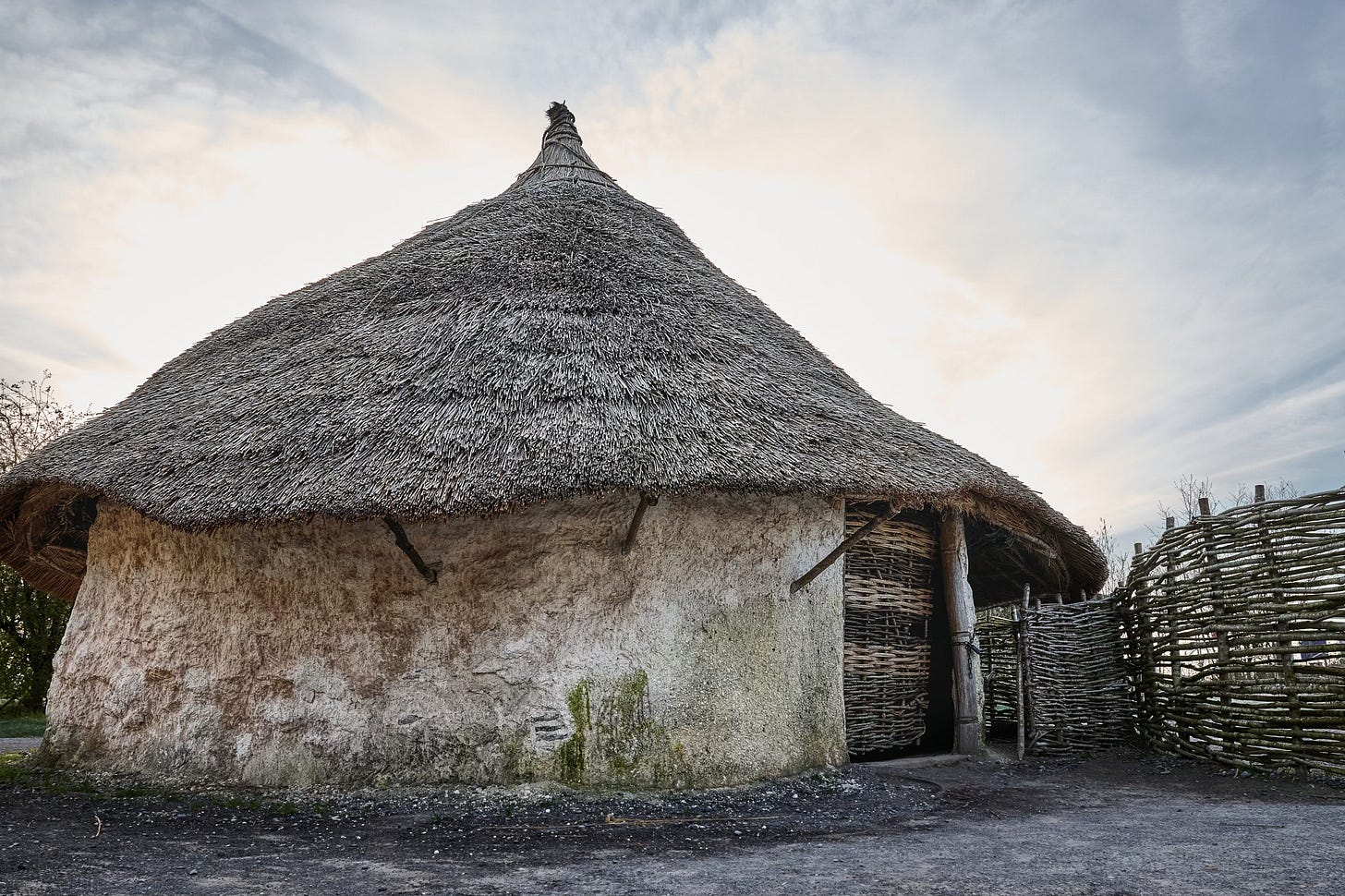 Documentary fieldwork photograph of a Neolithic Home in the Stonehenge Museum, showing the thatched roof and wattle-and-daub walls Documentary fieldwork photograph of a Neolithic Home in the Stonehenge Museum, showing the thatched roof and wattle-and-daub walls