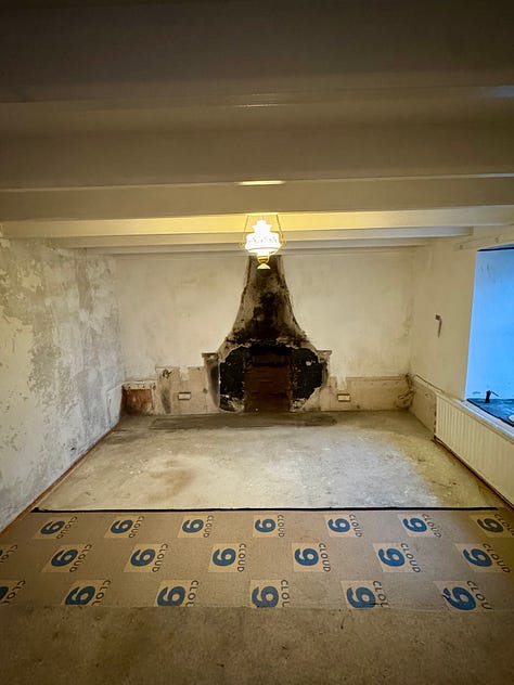 Five pictures of a much improved and cleared fireplace are after the rubble has been cleared from the builder drilling and smashing off the surrounds. 
