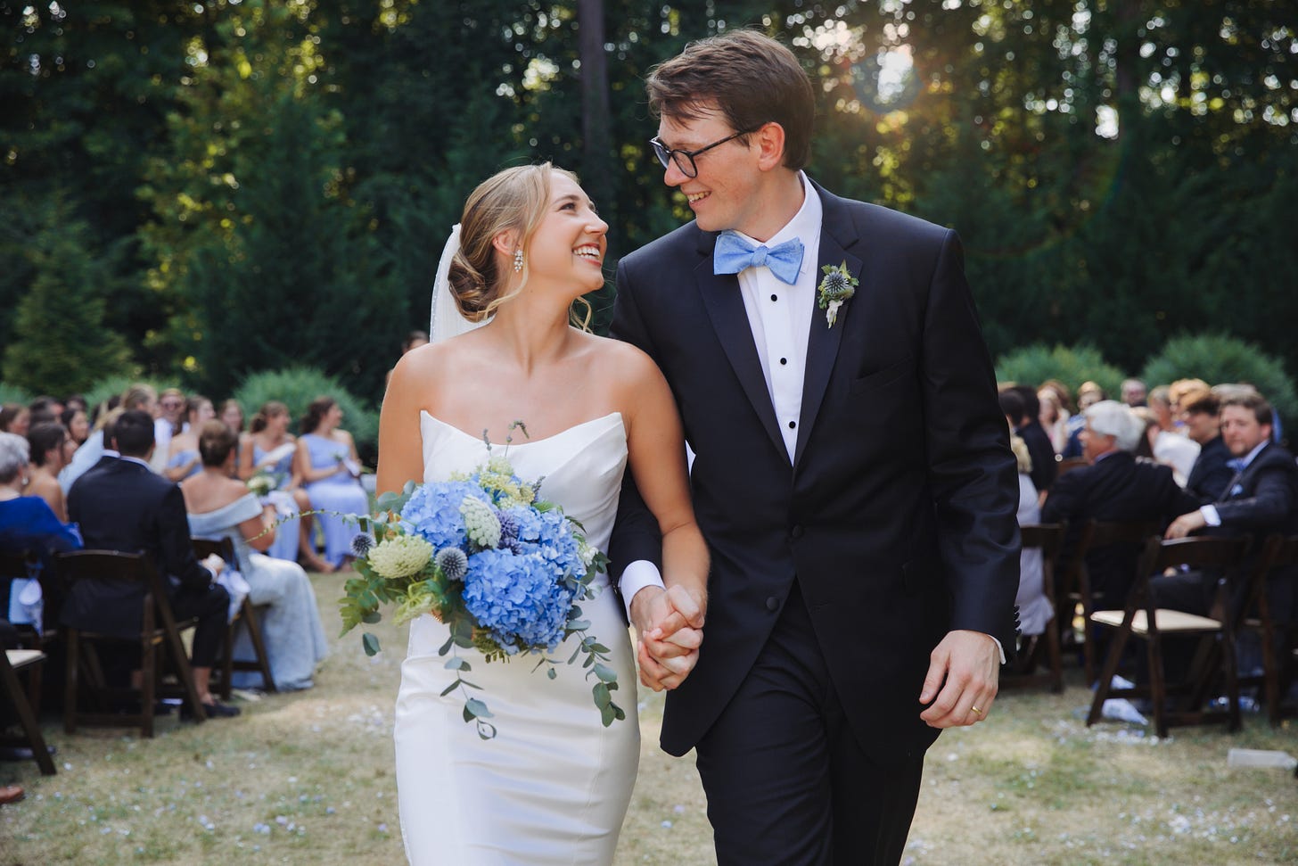 husband and wife walking down the aisle together