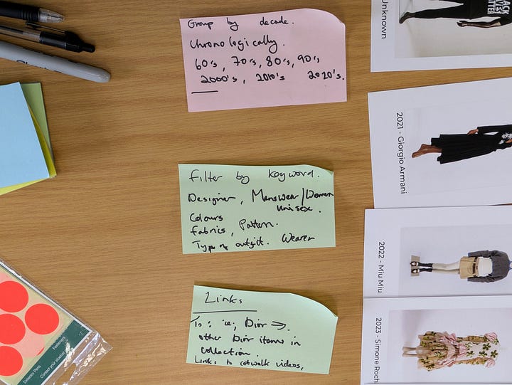 The first image shows a large table covered with printed fashion images from different decades, designers and labels, with coloured sticky notes marking decades or scores.  The second image shows close-up sticky notes with instructions like grouping chronologically, filtering by designer or fabric, and linking items across collections.