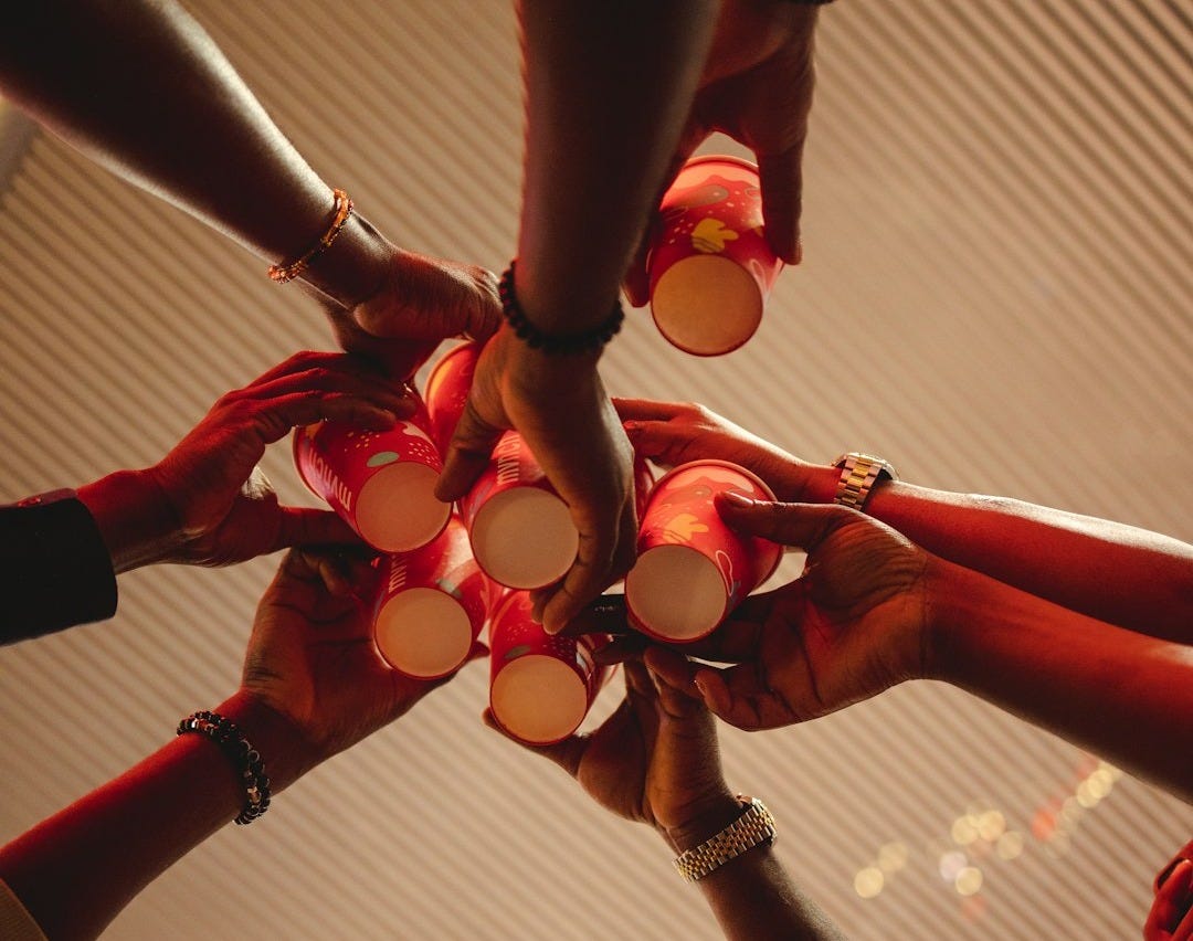 a group of people holding hands