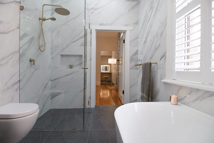 luxurious black and white ensuite bathroom designed by Plush Design Interiors and Penelope Herbert