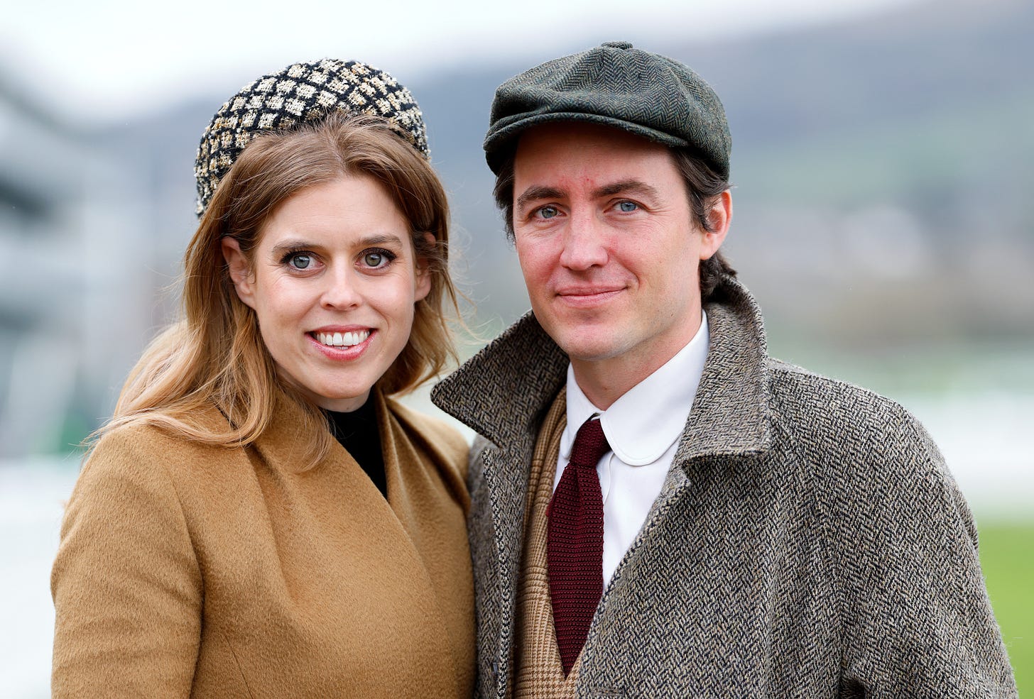 Princess Beatrice and Edoardo Mapelli Mozzi standing next to each other smiling
