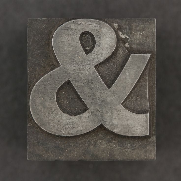 This may contain: the letter and number 8 is made out of metal