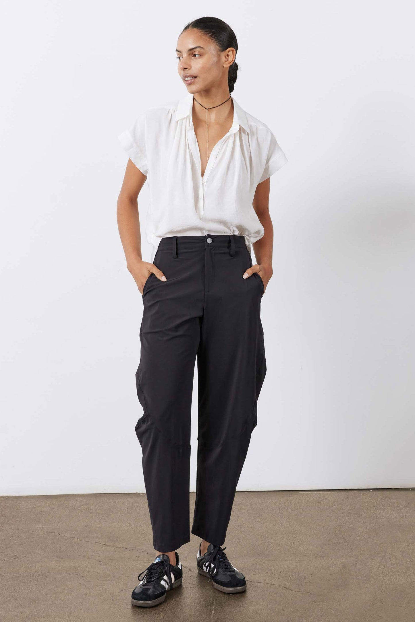Black wide-leg pants with button fly, belt loops, and cropped length