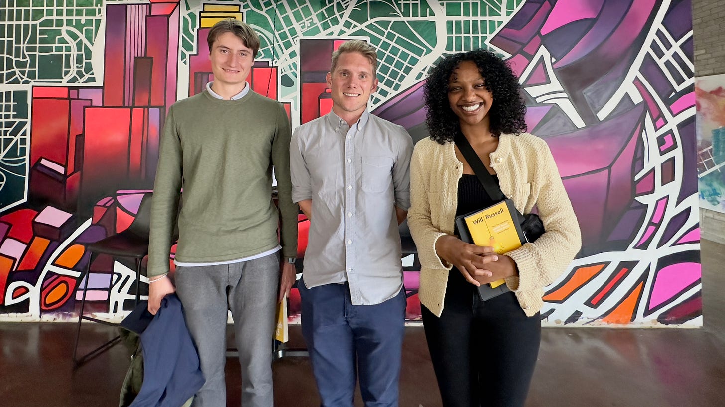 Will Russell, author of Launch in 5, center of picture with MCAD students Adrian and Heywan at Twin Cities Startup Week 2023.