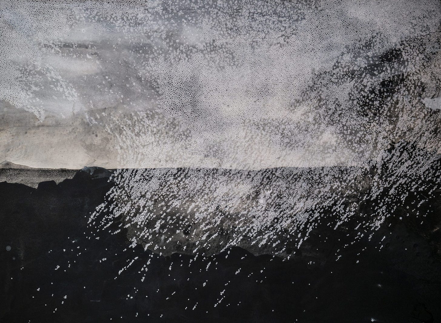 A drawing of a squall of raindrops