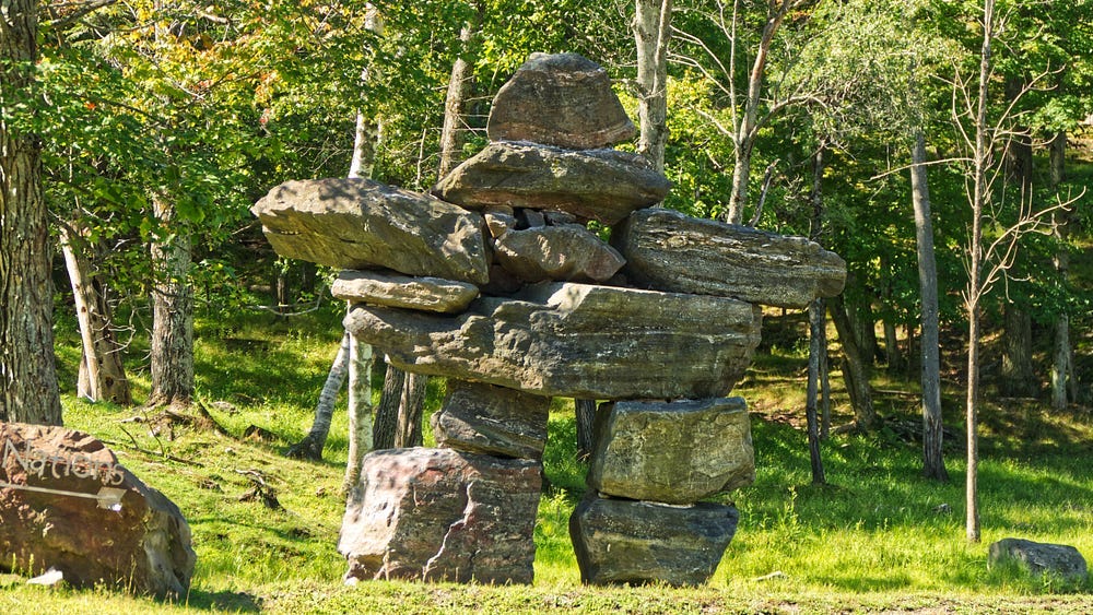 A pile of stones constructing an Inukshuk. A pile of stones constructing an Inukshuk.