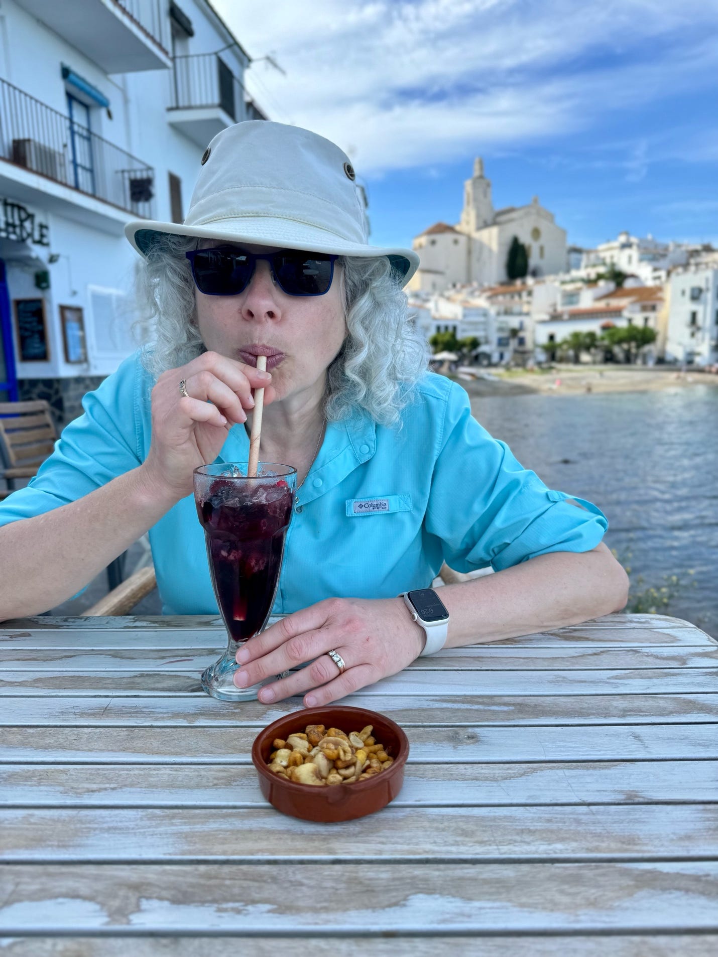 A person drinking from a straw

Description automatically generated