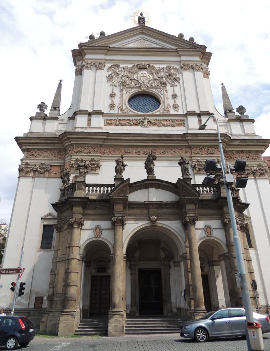 A white building with columns and a car parked in front of it

AI-generated content may be incorrect.