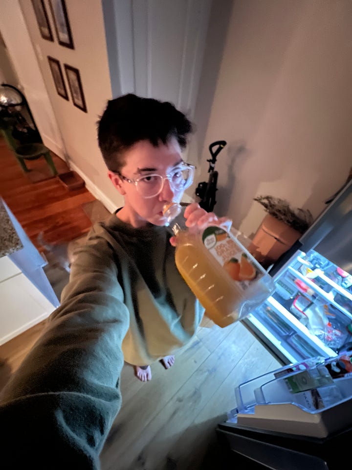 The first photo is Somer drinking orange juice in their kitchen. The next photo is Somer sipping on ramen in bed.