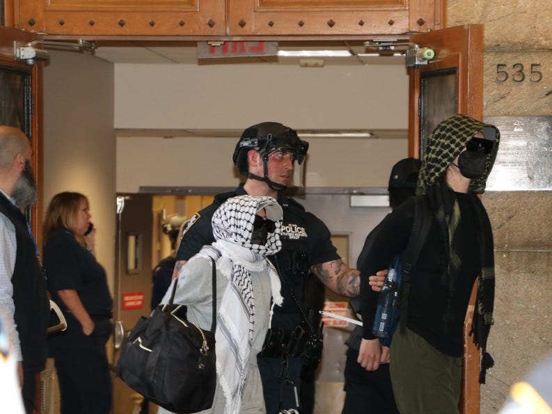 A group of people wearing helmets and masks
AI-generated content may be incorrect. A group of people wearing helmets and masks
AI-generated content may be incorrect.