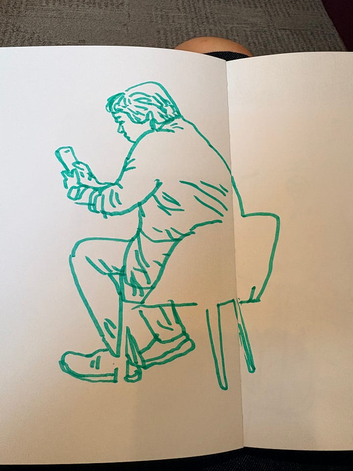 Drawings of men looking at phones drawn from life