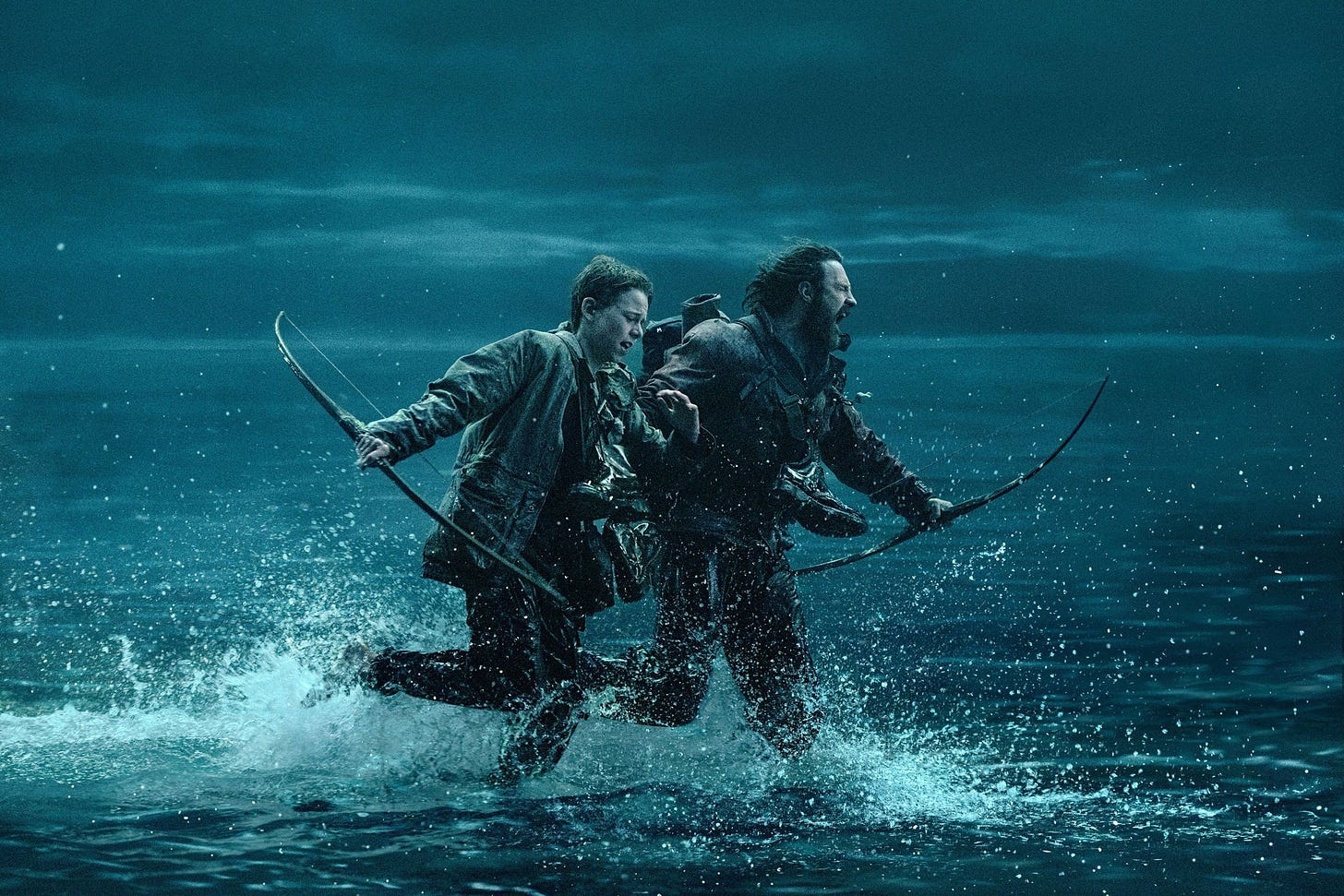 Two figures carrying bows and arrows while running through water.