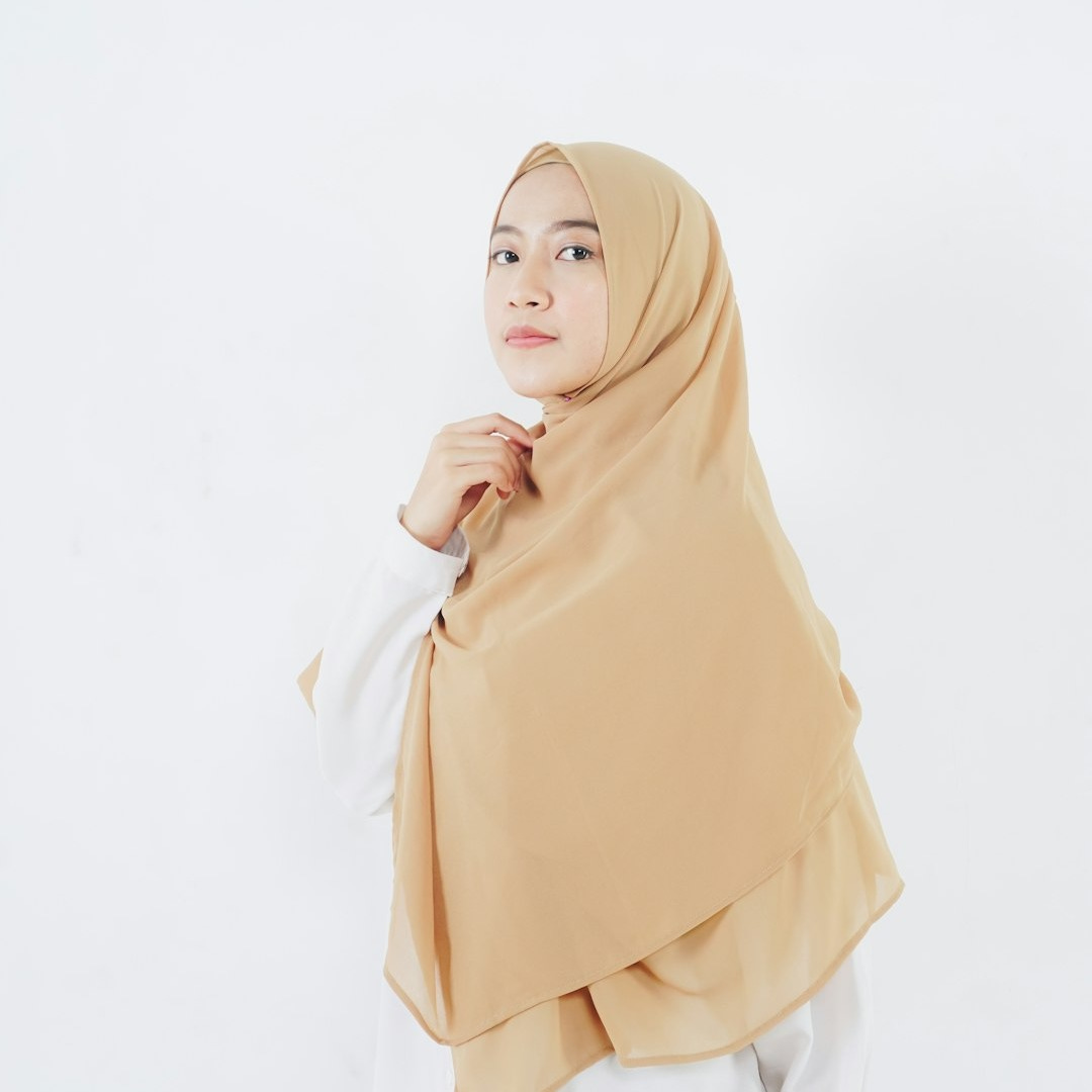 woman in beige hijab standing