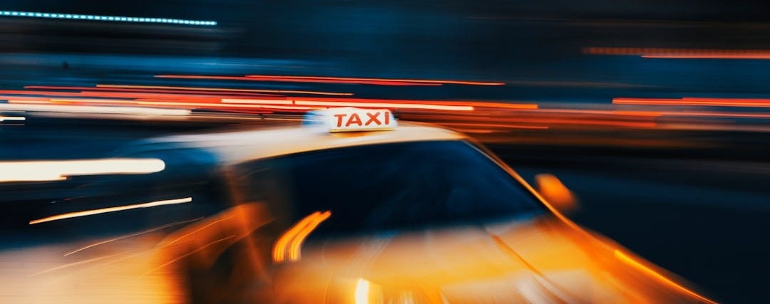 timelapse photography of orange vehicle