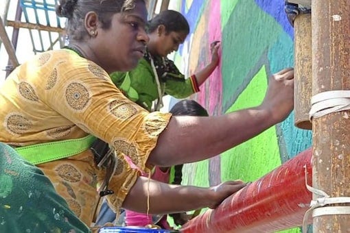 Pedestrians and motorists are amazed when they look up at the paintings, as the artists can be seen hanging off the wall several feet above ground with safety equipment. (Credits: News18)