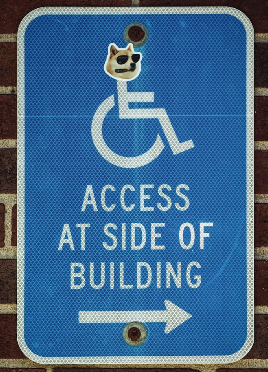 a blue sign on a brick wall that says access at side of building a blue sign on a brick wall that says access at side of building