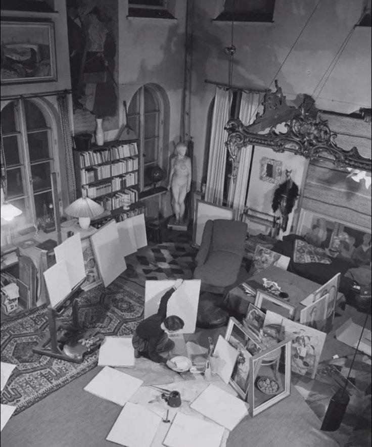 This may contain: a living room filled with lots of furniture and papers on the floor next to a fire place