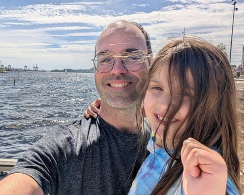 a man in glasses and a girl