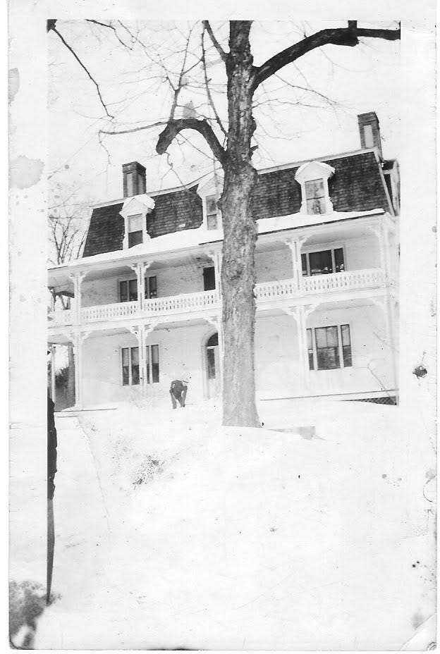 Shoveling snow at the Appleton House