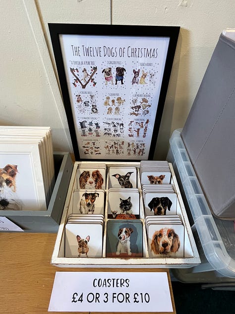 Photo of Dog portraits hung on the wall of the artist Jo Scotts Studio