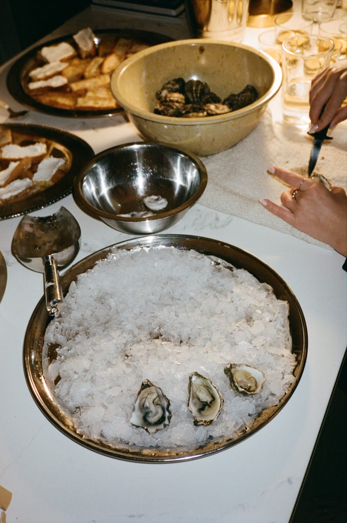 Kate Ludwig shucking oysters