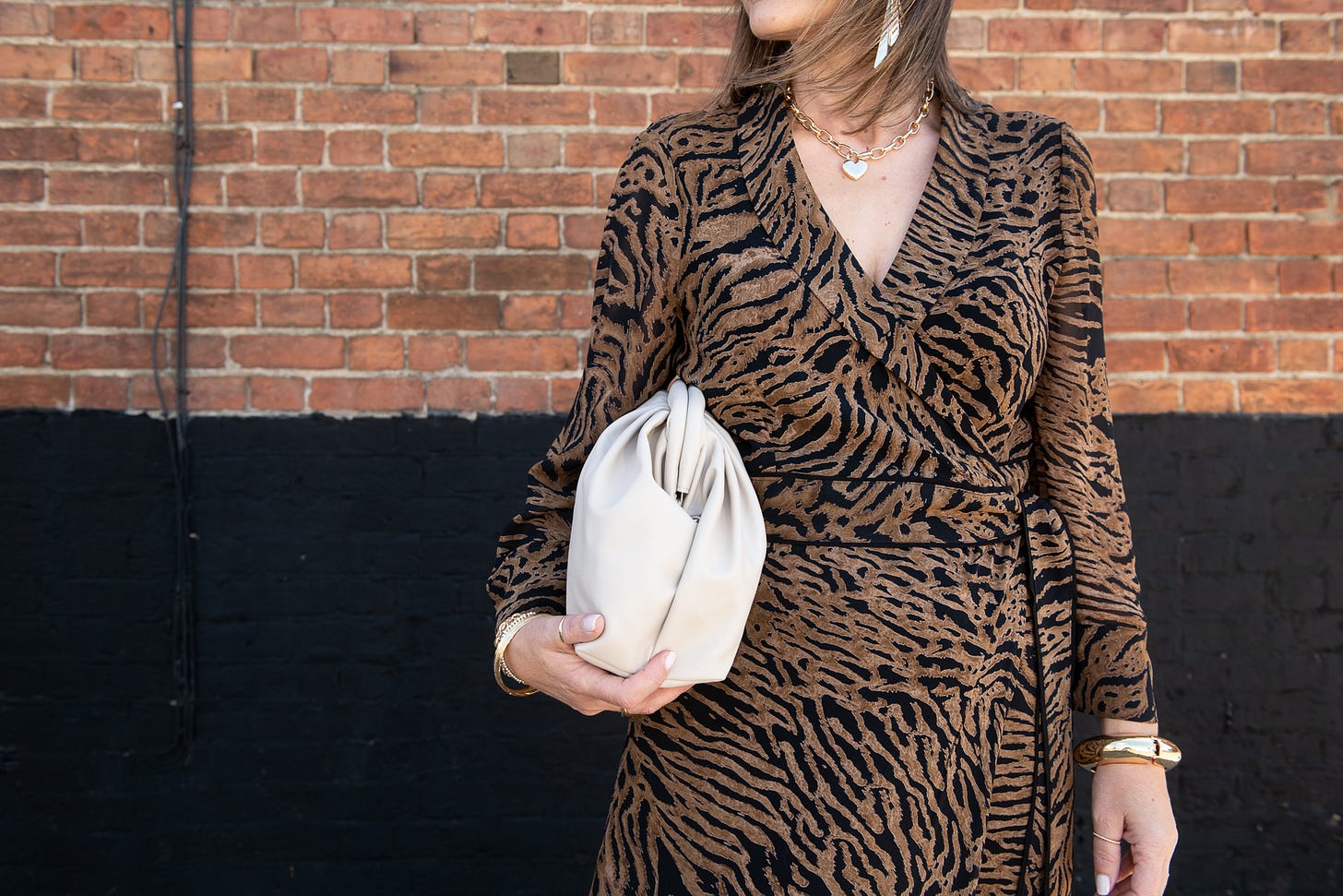 tiger fashion print with cream handbag