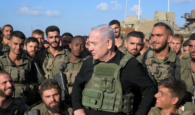 Prime Minister Benjamin Netanyahu met with soldiers from the IDF Golani Brigade 51st Battalion at an assembly point near Gaza.
