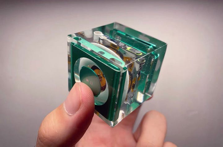Design in Resin: A rare glimpse into Apple's prototype stages. The iPod shuffle's control pad suspended in time.