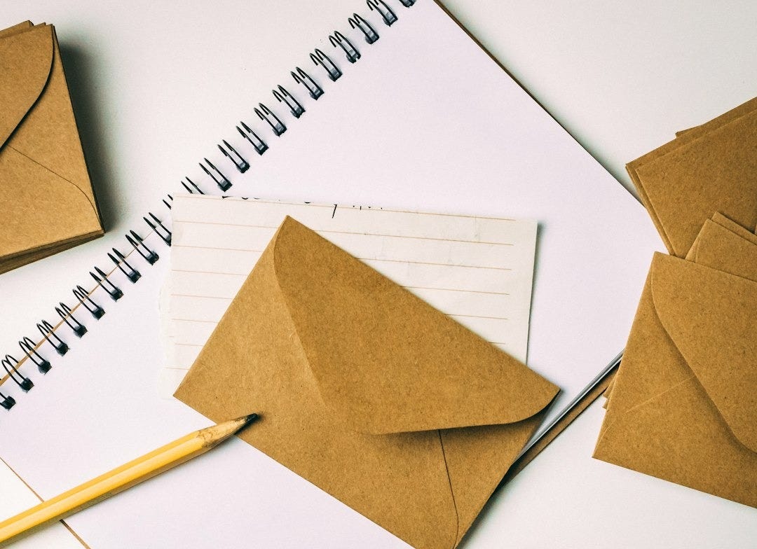 brown envelope on notebook brown envelope on notebook