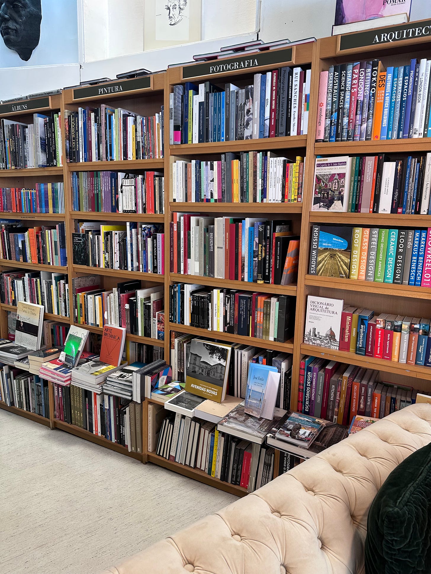 Couch and bookshelves at Tantos Livros bookshop in Saldanha, Lisbon Couch and bookshelves at Tantos Livros bookshop in Saldanha, Lisbon