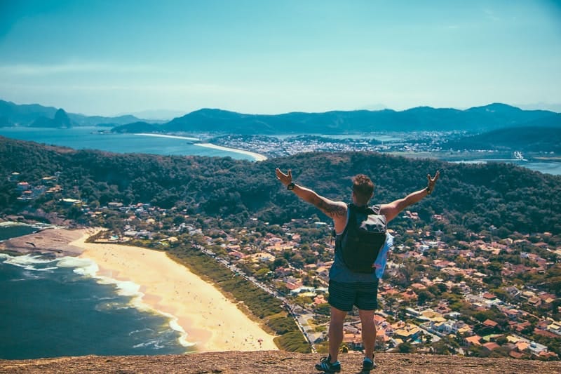 hiker overlooking a city