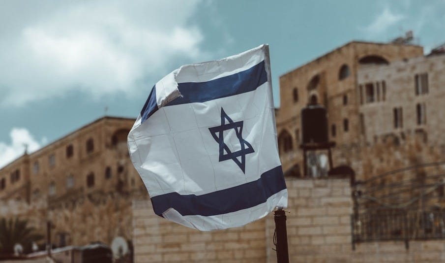 blue and white flag on pole