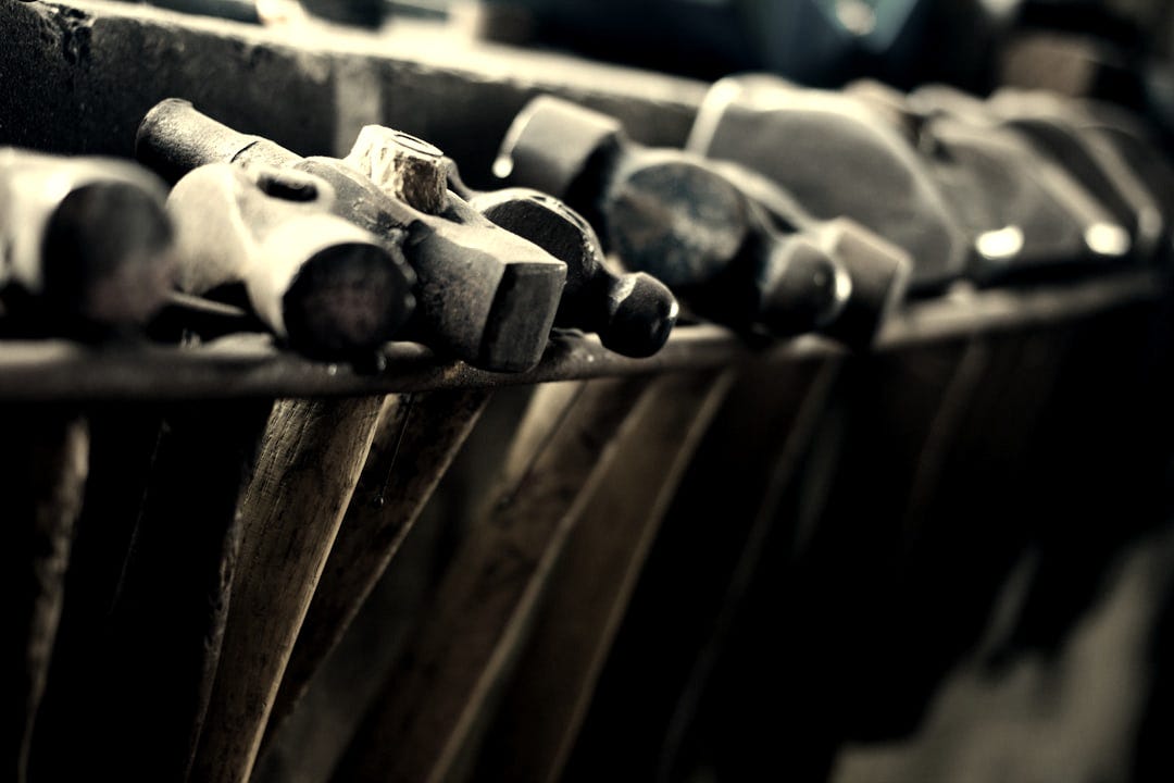 selective focus photo of black-and-brown ball-peen hammers selective focus photo of black-and-brown ball-peen hammers