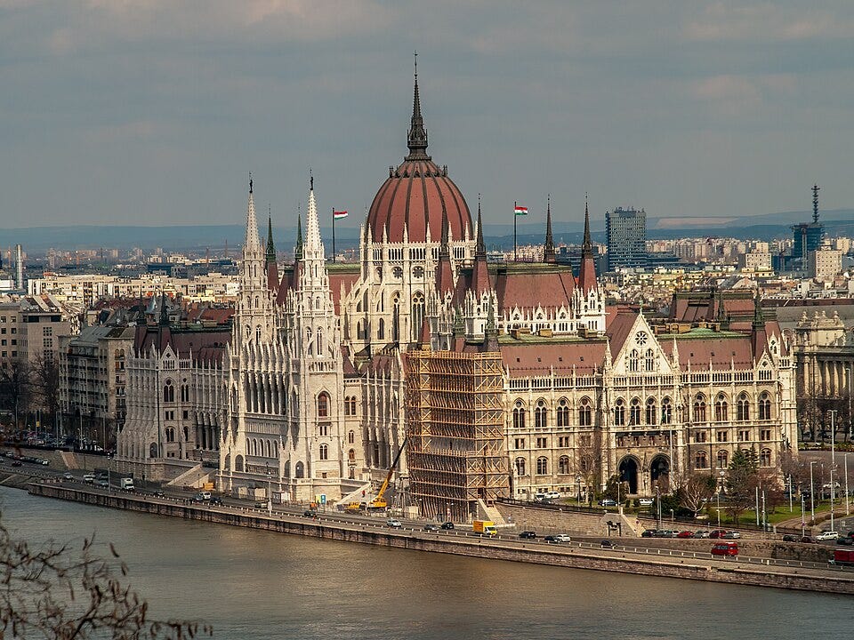 Exterior view of the Hungarian Parliament Building in Budapest, seen from across the Danube. Exterior view of the Hungarian Parliament Building in Budapest, seen from across the Danube.