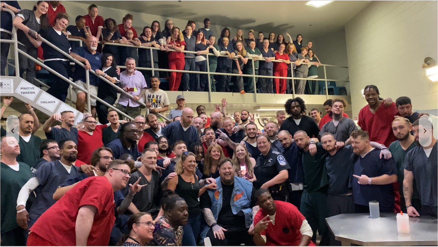 A colorful photo of about 90 HARP inmates enjoying the company of musician ‘Jelly Roll’ who performed a concert at the jail.