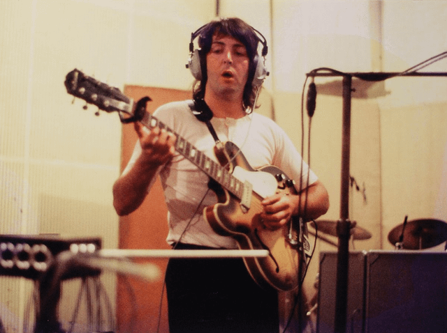 r/beatles - a person playing a guitar