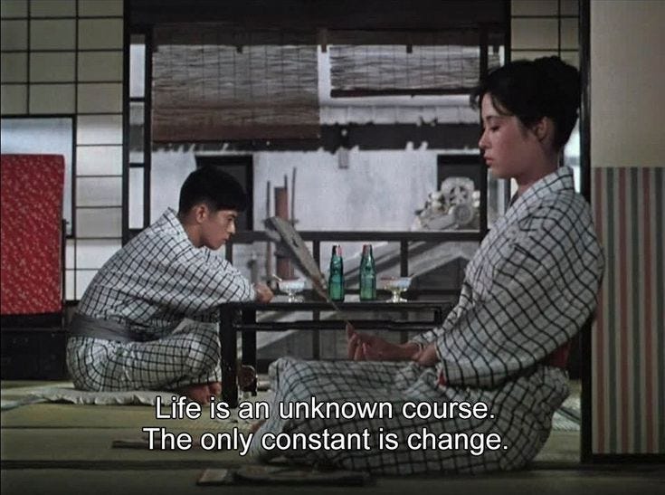 This may contain: two people sitting at a table in kimonos with text reading floating weeds 1950 director yasuro ozu life is an unknown course the only constant is change