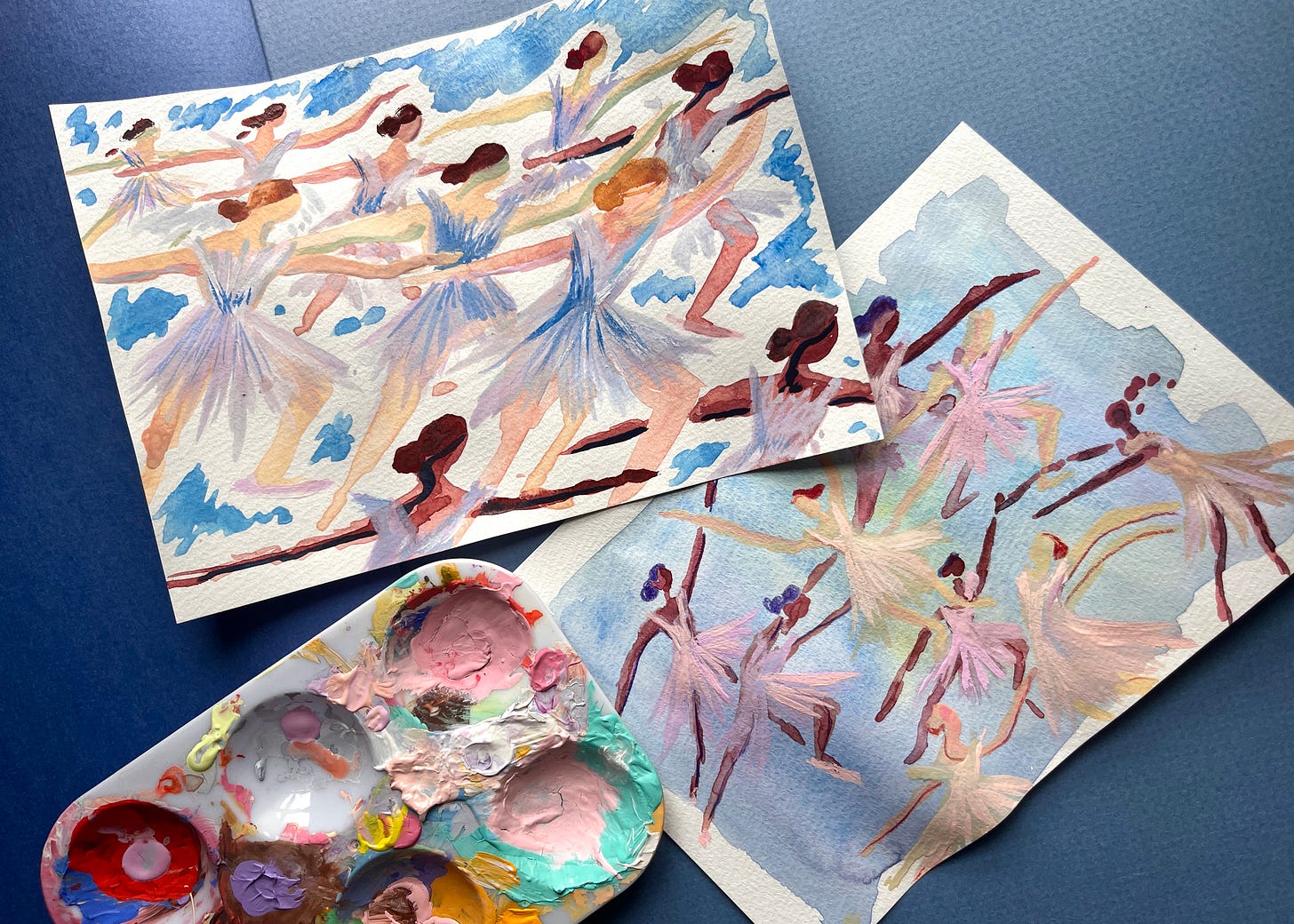 Two small mixed media sketches and a messy paint palette. The sketches show groups of ballerinas in unison motion. Two small mixed media sketches and a messy paint palette. The sketches show groups of ballerinas in unison motion.