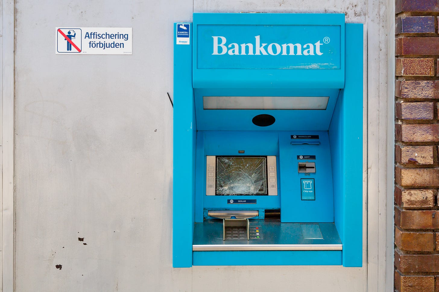 A vandalized ATM machine in Sweden.